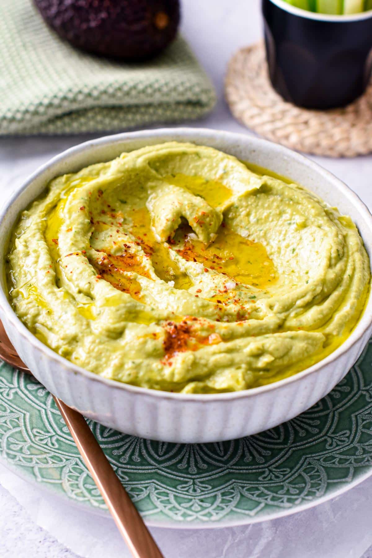 This Avocado Hummus is a creamy green hummus packed with avocado for a boost of healthy fats and ultra creamy texture. Plus, this easy hummus recipe is also vegan, gluten-free and dairy-free so everyone can dip in.