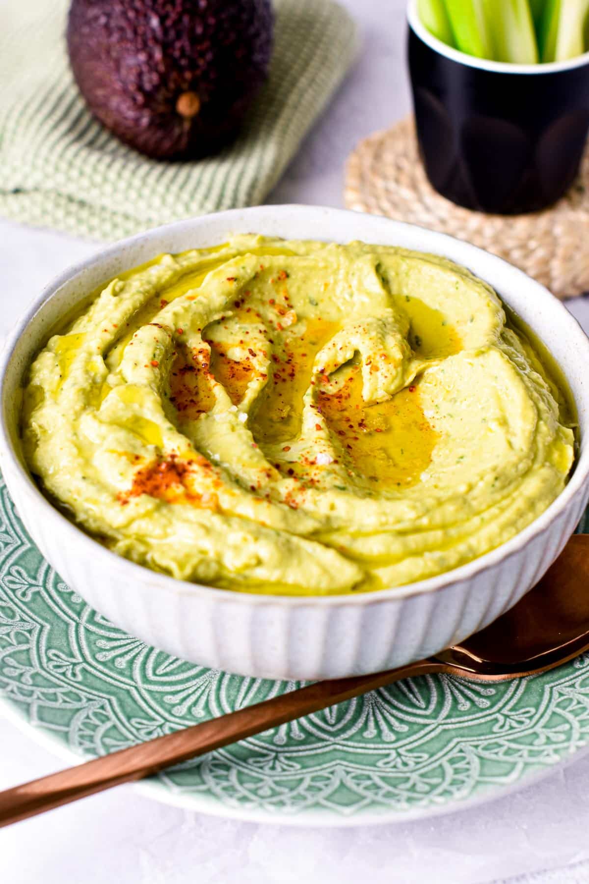 This Avocado Hummus is a creamy green hummus packed with avocado for a boost of healthy fats and ultra creamy texture. Plus, this easy hummus recipe is also vegan, gluten-free and dairy-free so everyone can dip in.