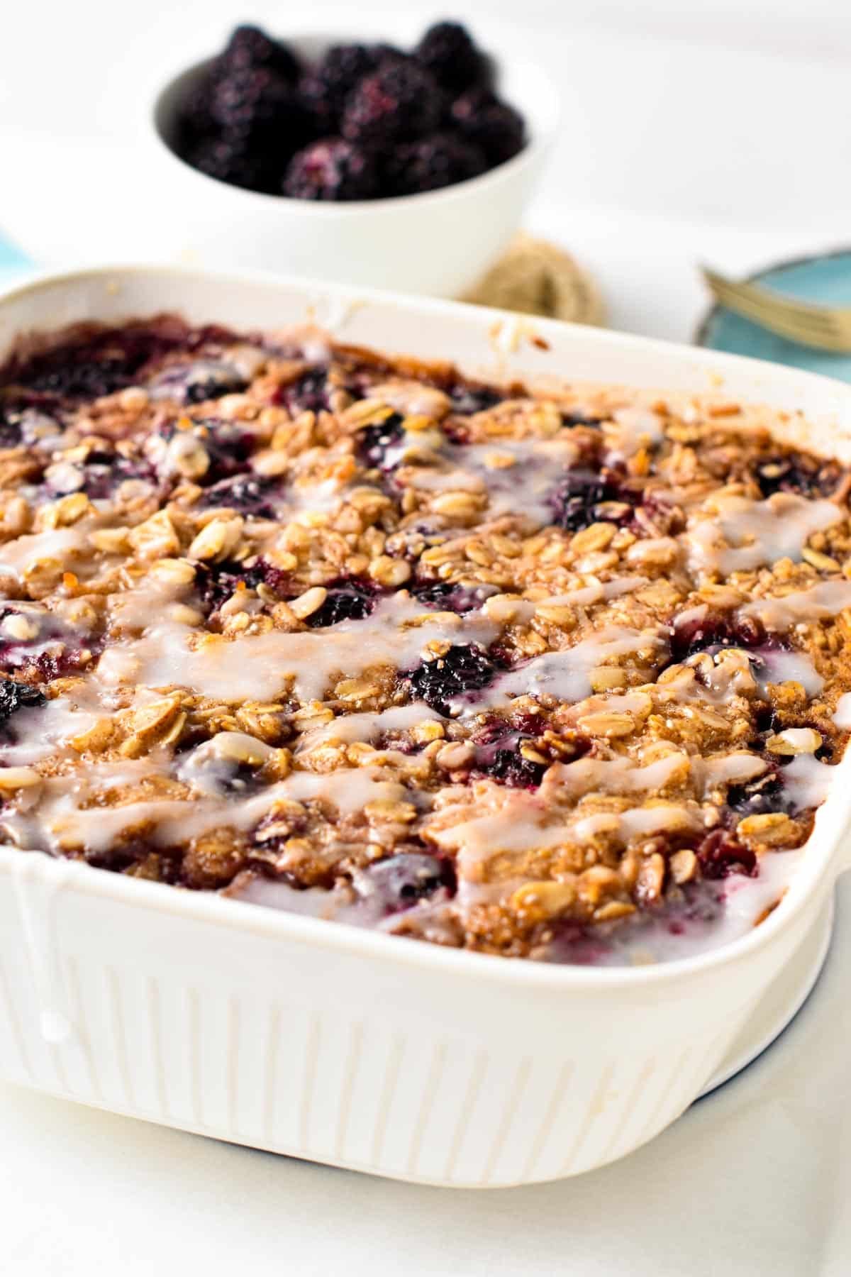 This Blackberry Oatmeal Bake is an easy, healthy one-pan oatmeal breakfast filled with juicy blackberries. It's perfect to feed healthy breakfast to all the family on busy morning and starts the day full of energy.