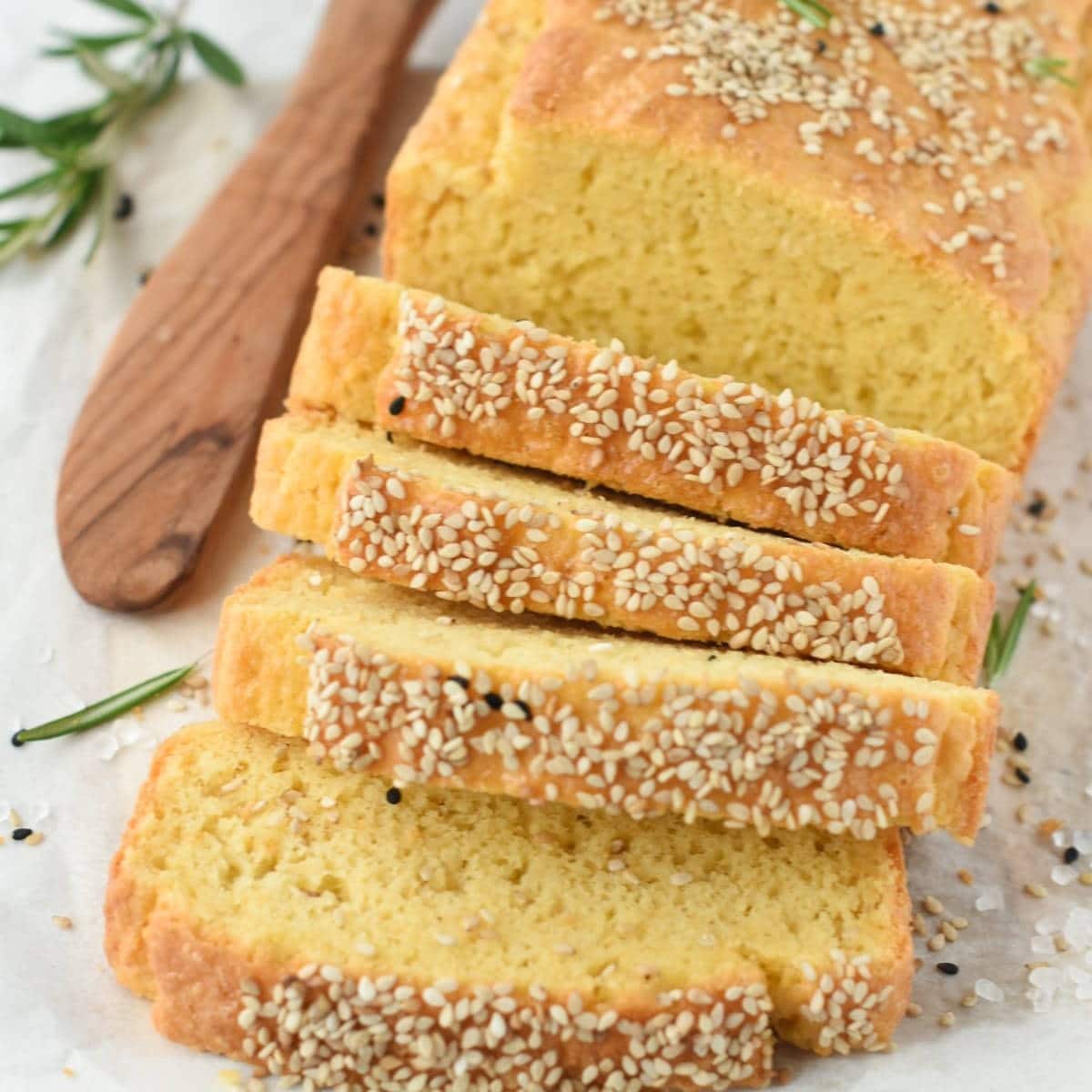 Cassava Bread loaf with a few slices in front.