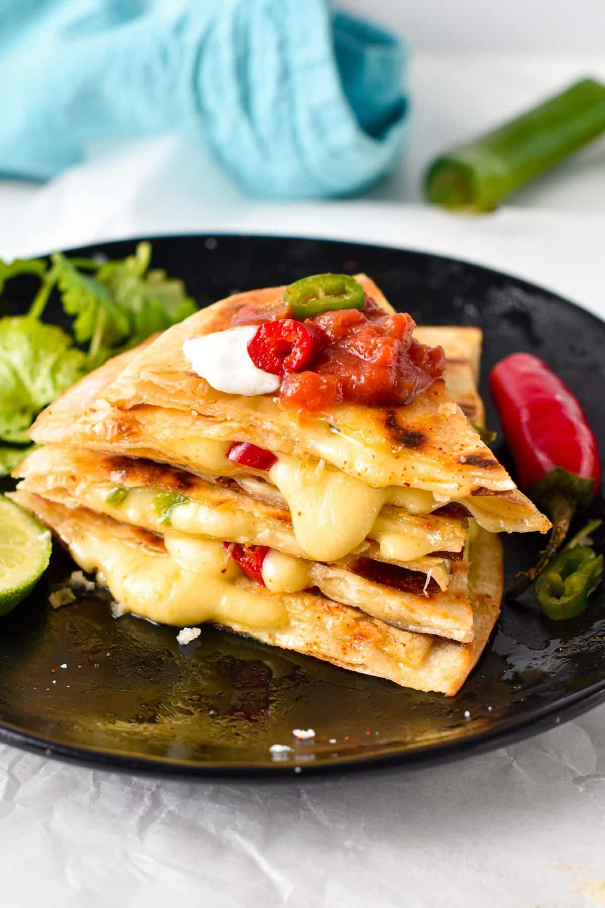 This easy Cheese Quesadilla also called Queso quesadilla is a crispy flour tortilla filled with stringy melted cheese and pieces of jalapeno. This is the perfect 10 minutes lunch for cheese lovers, easy to adapt by throwing in any extra vegetables or proteins you have on hand.