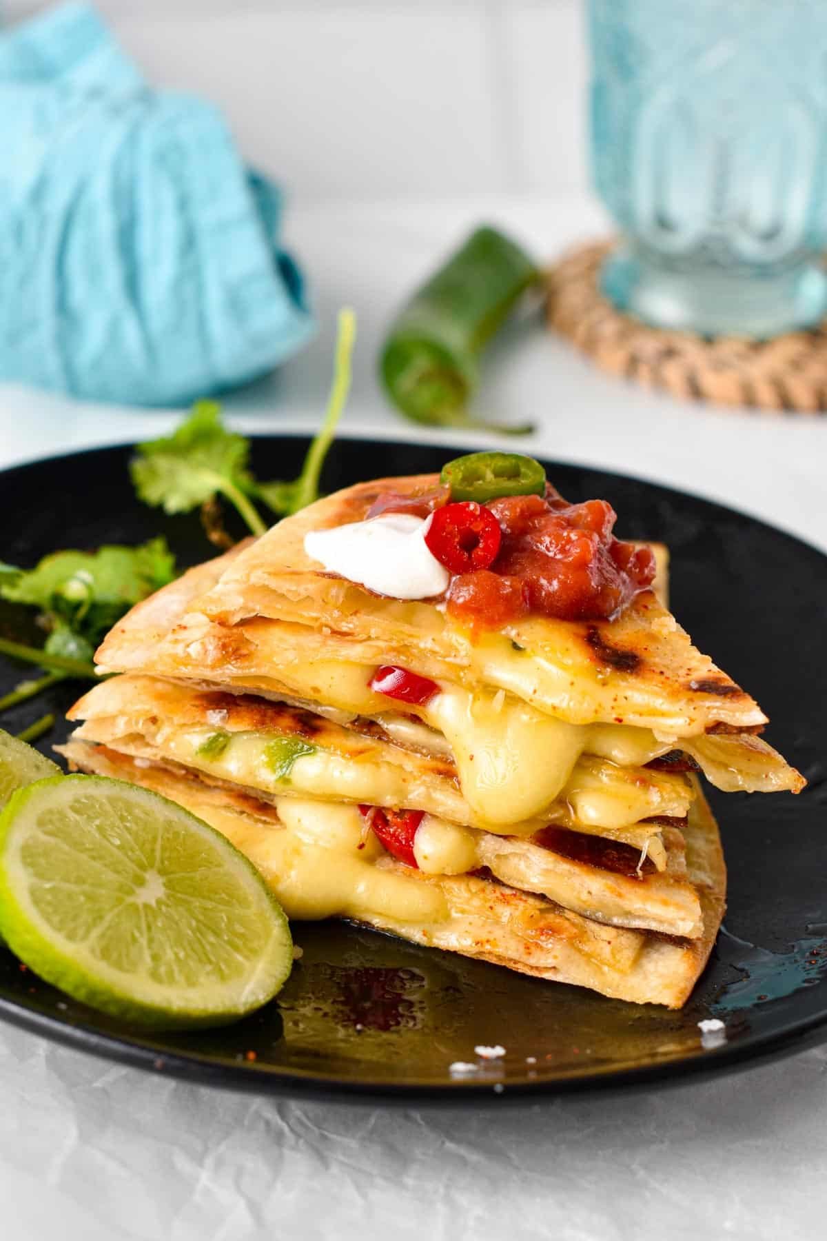 This easy Cheese Quesadilla also called Queso quesadilla is a crispy flour tortilla filled with stringy melted cheese and pieces of jalapeno. This is the perfect 10 minutes lunch for cheese lovers, easy to adapt by throwing in any extra vegetables or proteins you have on hand.