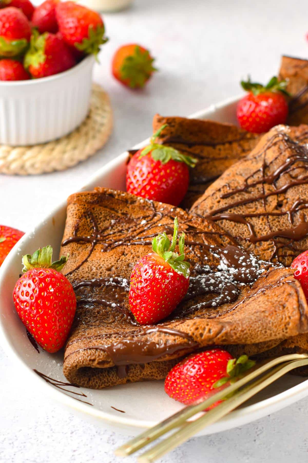 These Chocolate Crepes are thin chocolate French crepes perfect to fill with whipped cream, yogurt, or berries. It's an easy pancake recipe for breakfast or a delicious french dessert to impress.These Chocolate Crepes are thin chocolate French crepes perfect to fill with whipped cream, yogurt, or berries. It's an easy pancake recipe for breakfast or a delicious french dessert to impress.