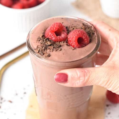 A thick, creamy, and decadent Chocolate Raspberry Smoothie with fudgy chocolate texture and fruity raspberry flavors.