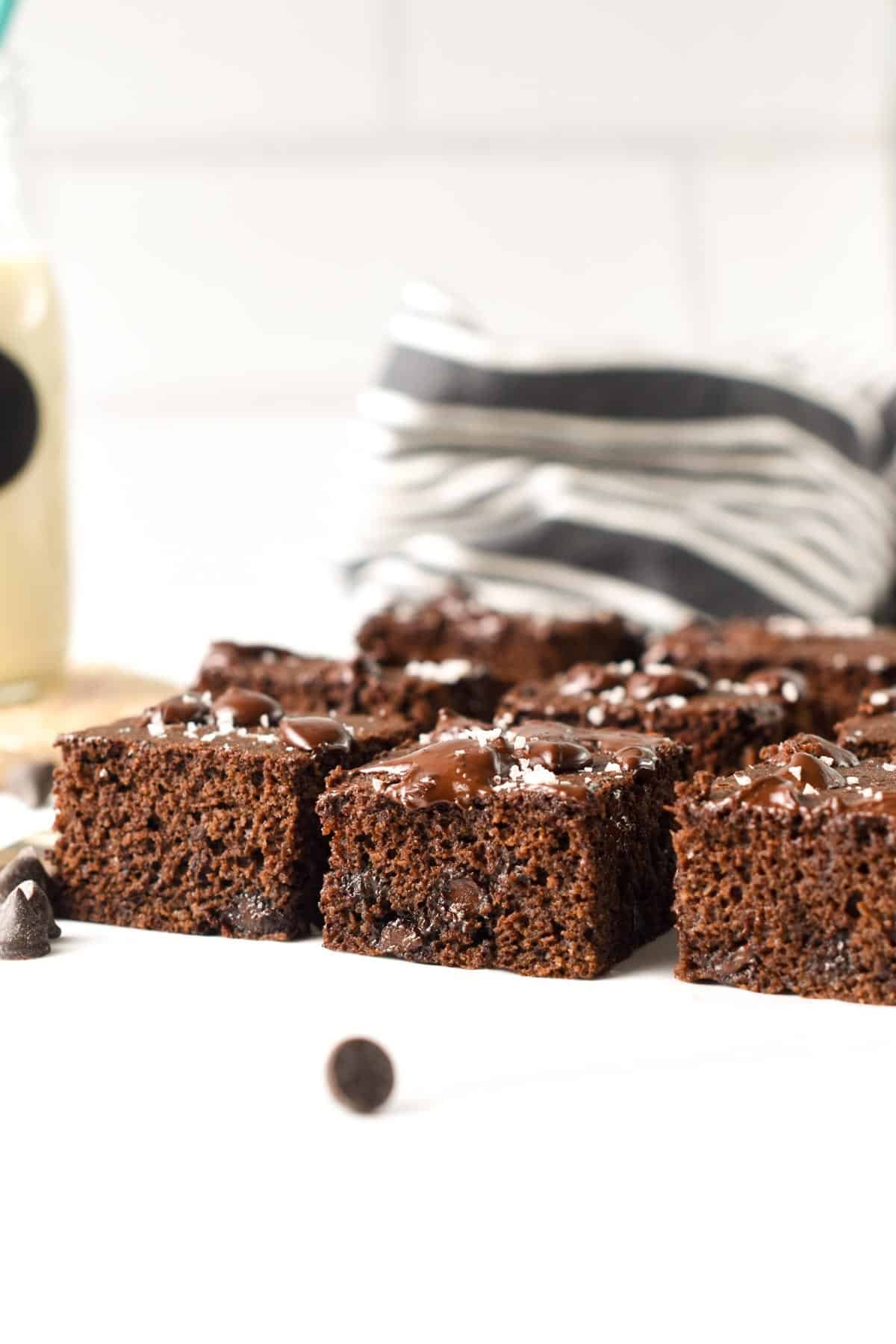 Coconut flour brownies sliced on a table.