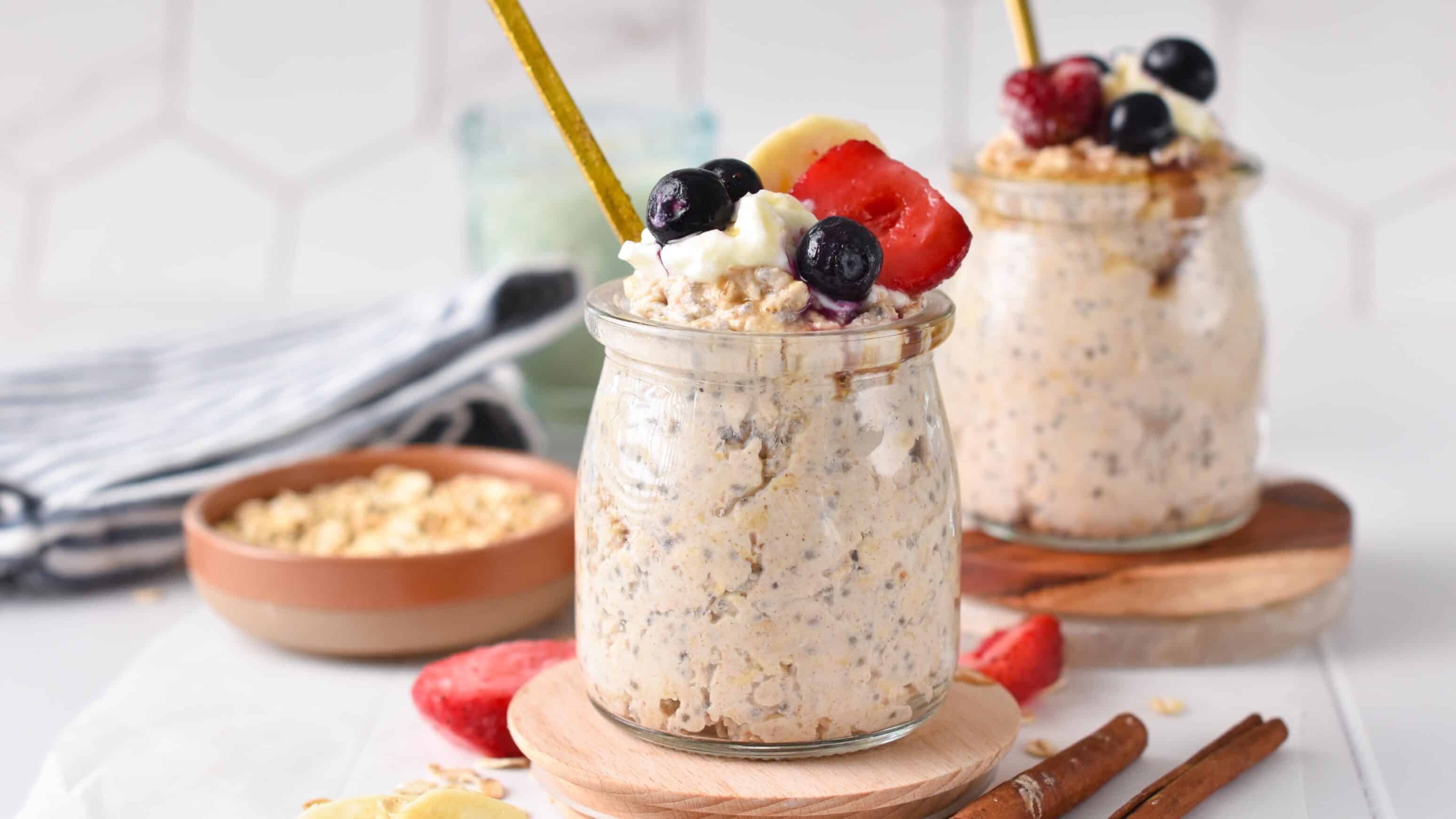A jar of cottage cheese overnight oats with berries on top.