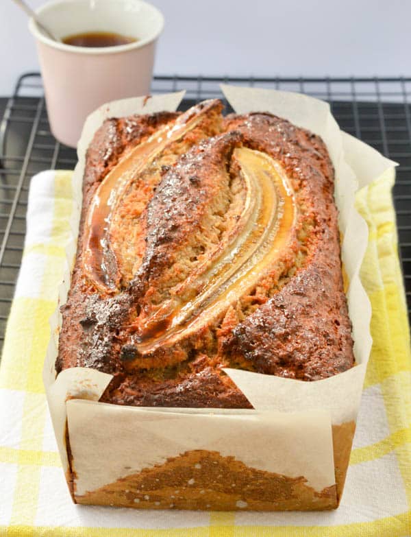 Simple healthy banana bread recipe with Greek Yogurt, coconut oil and whole wheat flour. A delicious moist banana bread sweetened with honey