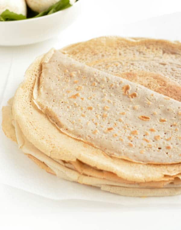 French Buckwheat Crepes are gluten free savory crepes made of 100% buckwheat flour, water, egg and salt. It is an easy and healthy 4 ingredients crepes recipe with moist center and crispy borders that French people love to eat for dinner stuffed with spinach and mushroom or ham and cheese.