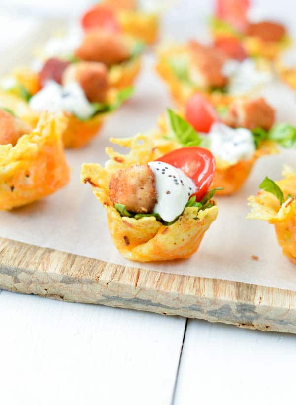 Crispy Carrot Parmesan Cups are perfect bite-size bowls to serve caesar salad. A cute easy healthy appetizer for your next party. Gluten free, low carb.