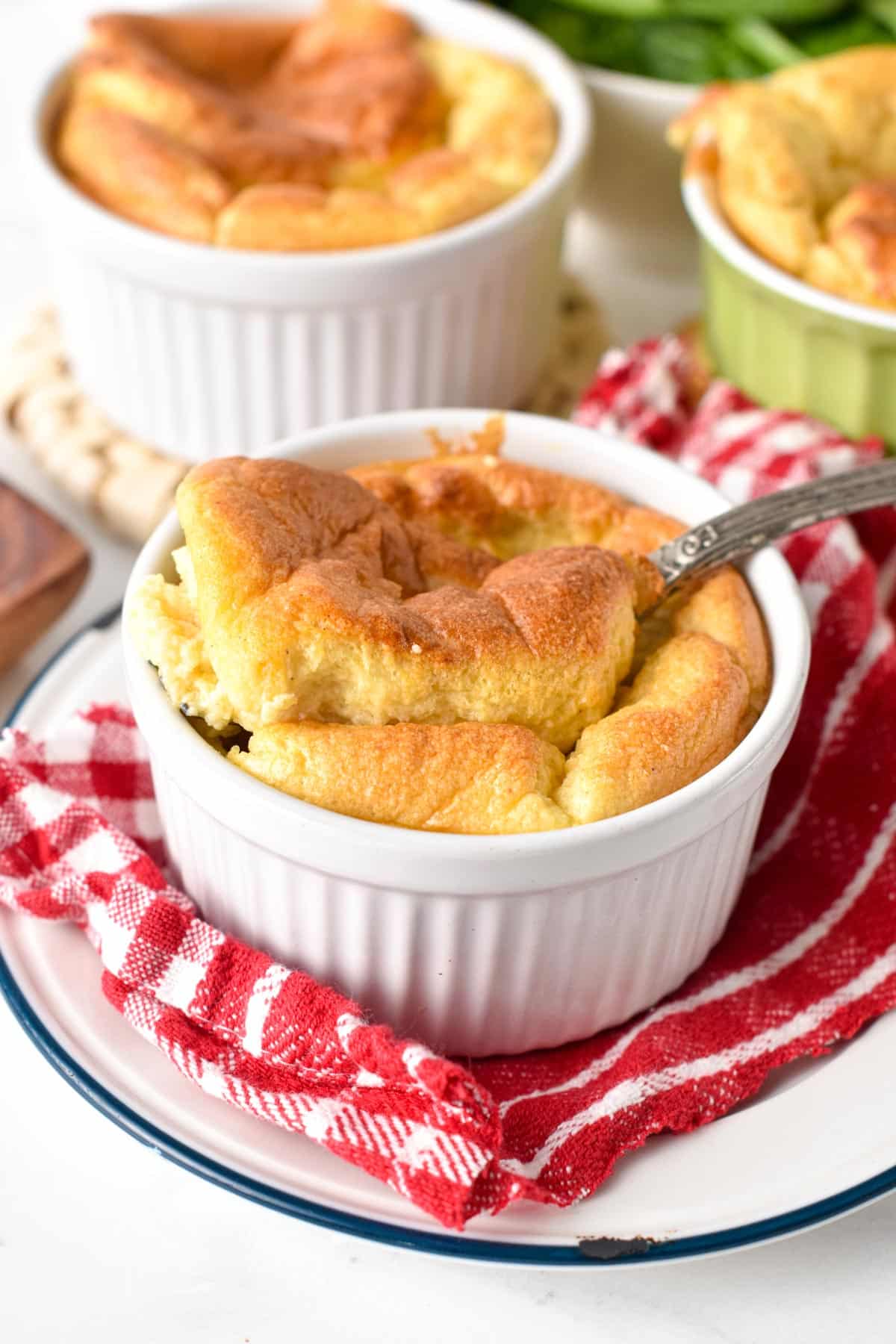 These Egg Souffles are fluffy eggs baked in single-serve ramekins with a fancy look perfect as a brunch recipe. Plus these egg souffles are ready in less than 30 minutes and are a great way to feed a breakfast crowd on the weekend with a fancy egg breakfast recipe.