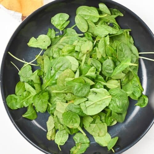 Baby spinach in a skillet