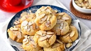 These Greek Almond Cookies are easy melt in your mouth almond flour cookies coated with crunchy toasted sliced almonds. Plus, these are also naturally gluten-free with keto friendly option.