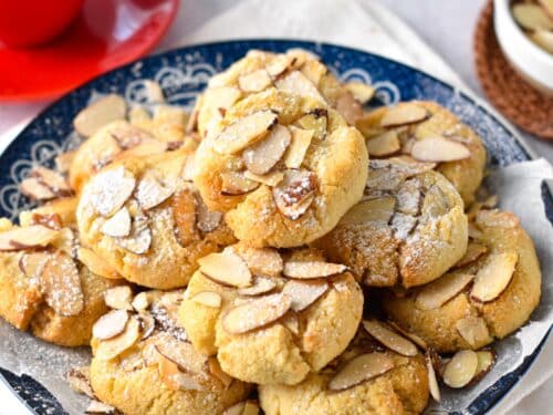 These Greek Almond Cookies are easy melt in your mouth almond flour cookies coated with crunchy toasted sliced almonds. Plus, these are also naturally gluten-free with keto friendly option.