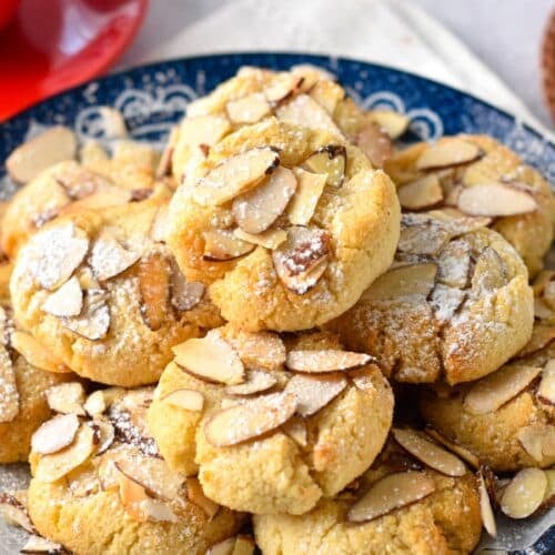 These Greek Almond Cookies are easy melt in your mouth almond flour cookies coated with crunchy toasted sliced almonds. Plus, these are also naturally gluten-free with keto friendly option.