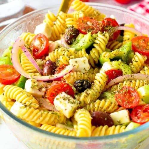 This Greek Pasta Salad is an healthy fulfilling salad packed with Greek flavors and crunchy vegetable. If you love salad as a meal, this easy 20 minutes Greek Pasta salad recipe is for you.