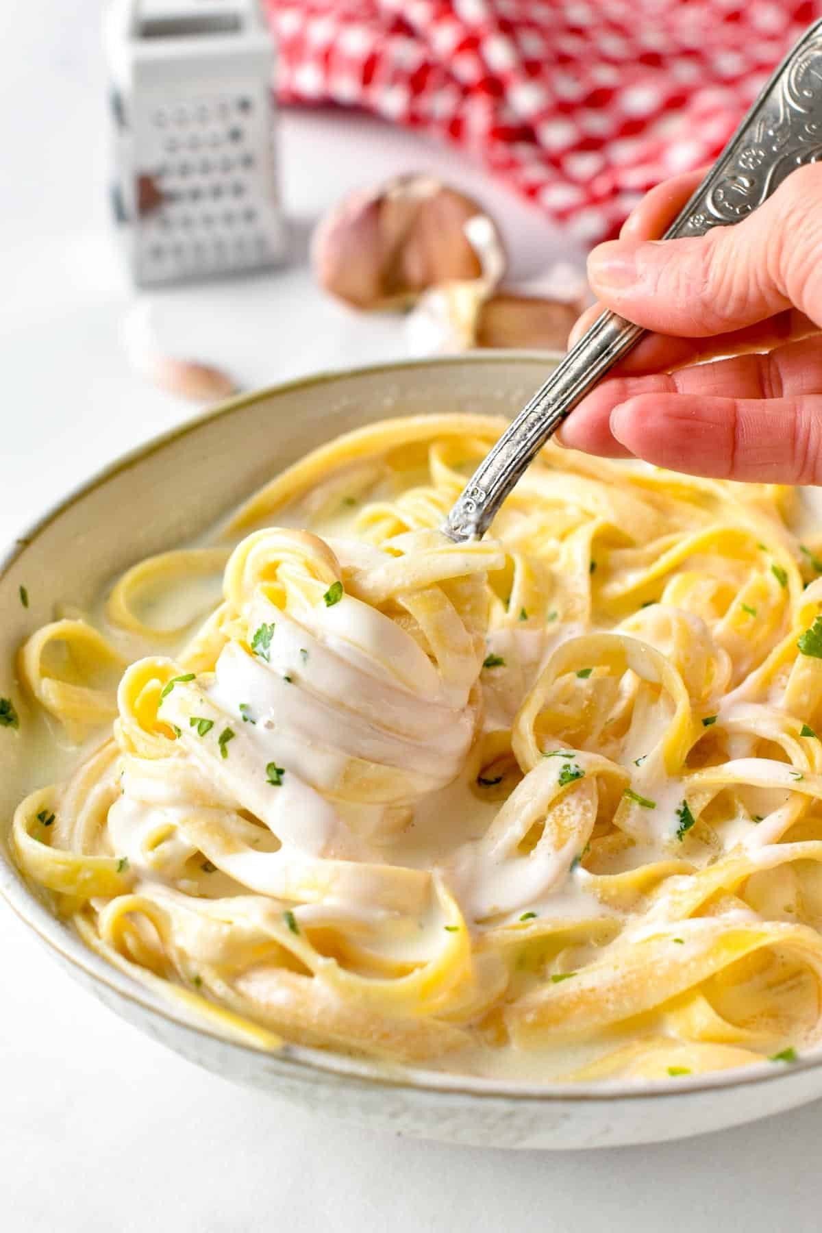 This Alfredo Greek Yogurt Pasta sauce is a lightened-up version of the traditional Alfredo sauce recipe. It's packed with proteins from Greek yogurt, lower in fats and calories but with the same delicious creamy garlic flavors you love.