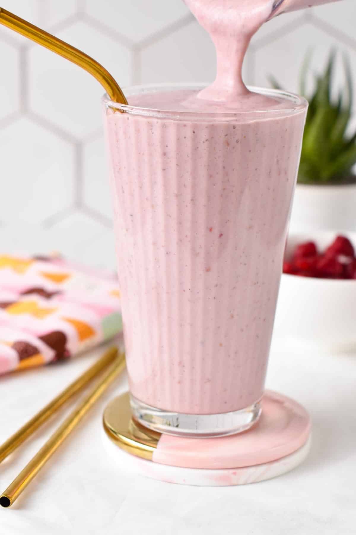 This Greek Yogurt Protein Shake is a deliciously creamy and smooth raspberry protein shake packed with 40 grams of proteins.