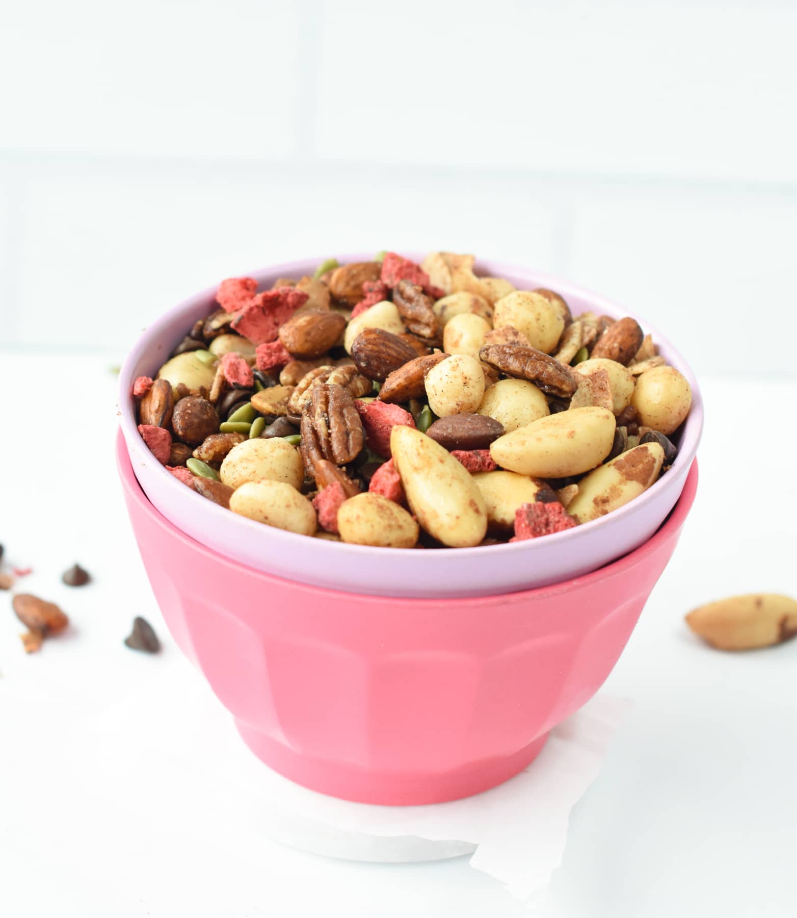 Healthy trail mix in a pink bowl.