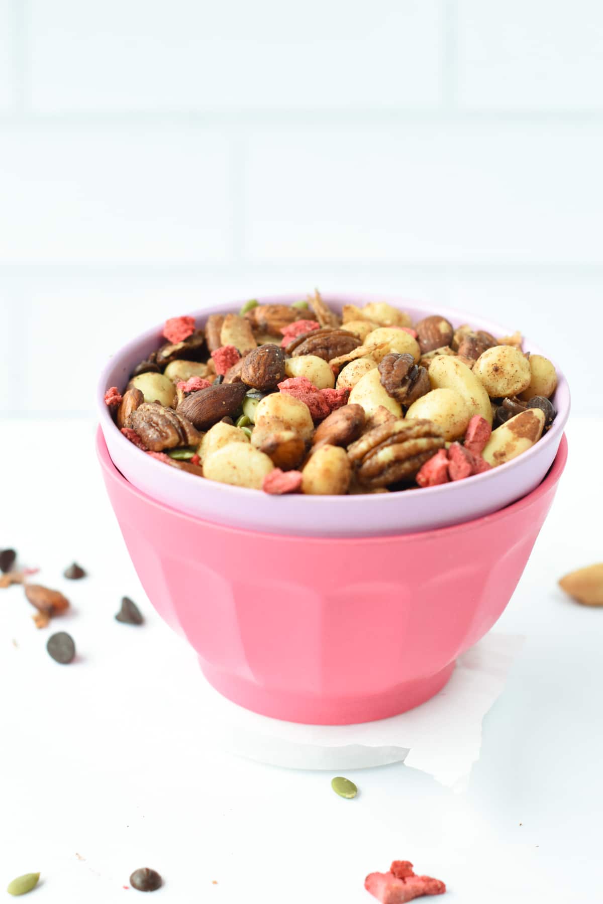 Healthy trail mix in a pink cup.