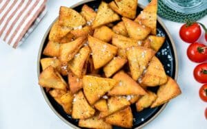 These Homemade Pita Chips are easy, crispy chips made from pita pocket bread and ready in less than 20 minutes. They are perfect the best homemade chips to dip in and serve on your appetizer food platter with raw vegetable.