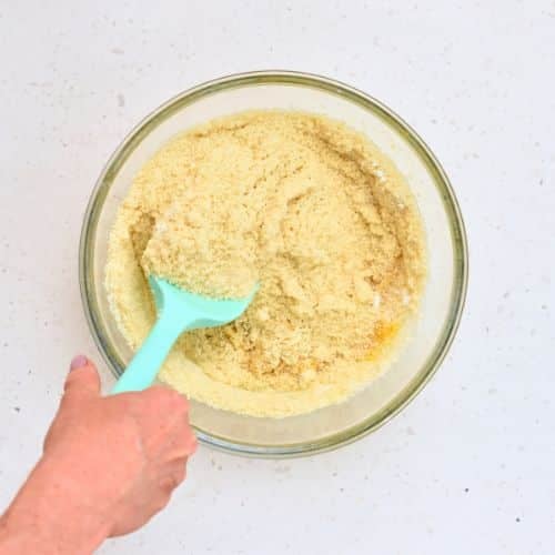 Stirring almond flour in a the Almond Flour Cake batter.