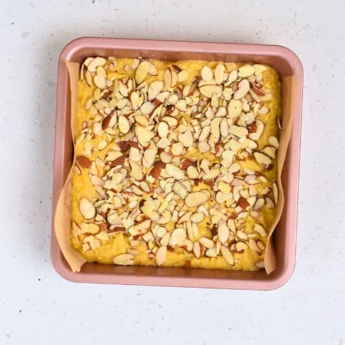 Almond Flour Cake ready to bake in a square pan.