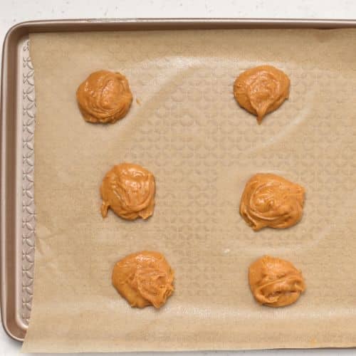 Cloud Cookies ready to bake on a cookie sheet.