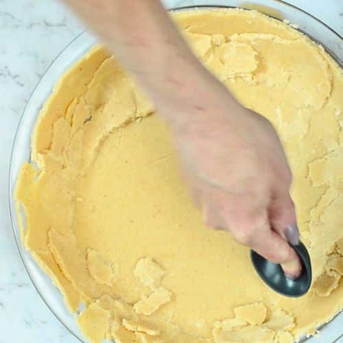 Forming Keto Pumpkin Pie crust.