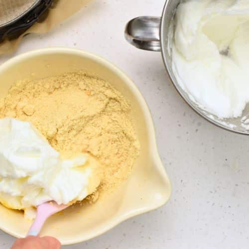 Adding whisked egg white to the Lemon Almond Cake batter.