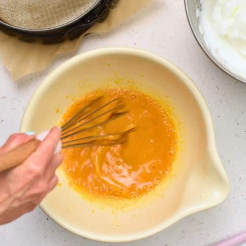 Whisking eggs in a bowl.