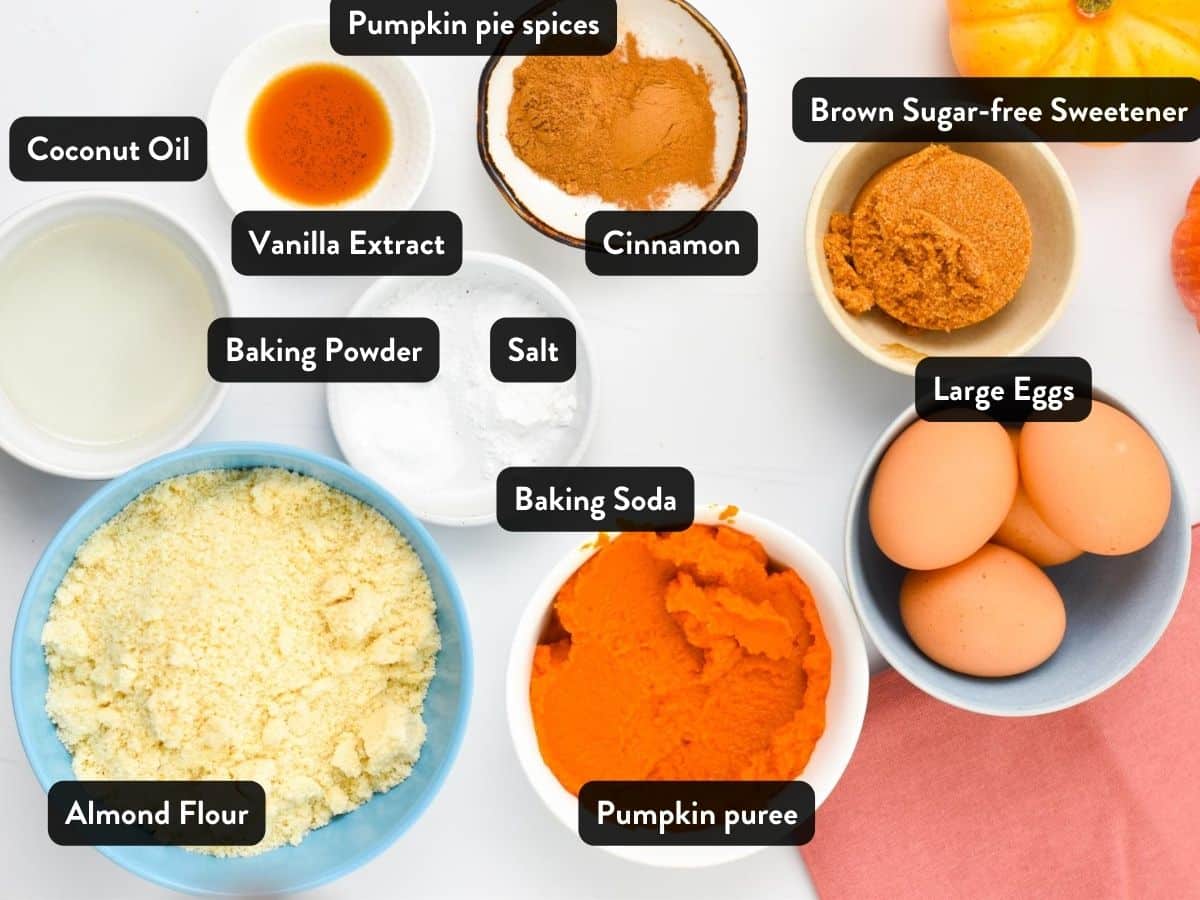Ingredients for Keto Pumpkin Cake in small bowls and ramekins with labels.