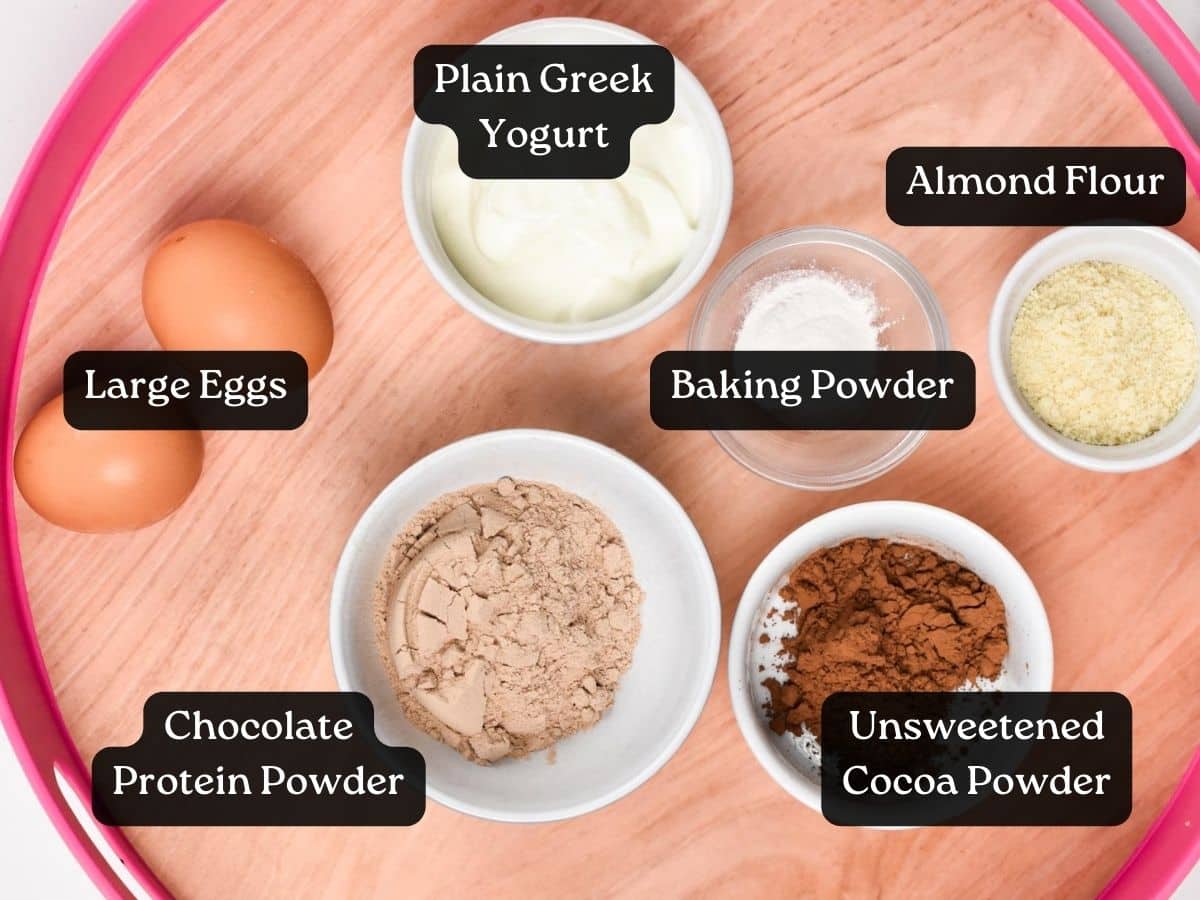 a picture of all the ingredients for chocolate protein pancakes in small bowls