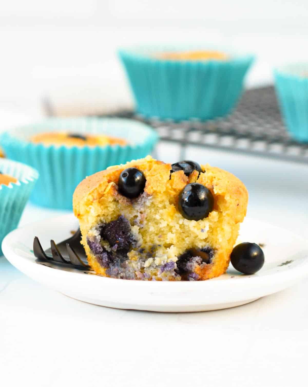 the inside of a keto blueberry muffins with juicy blueberries
