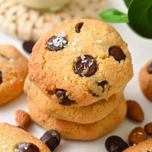 a stack of keto chocolate chips cookies and a pinch of salt on top