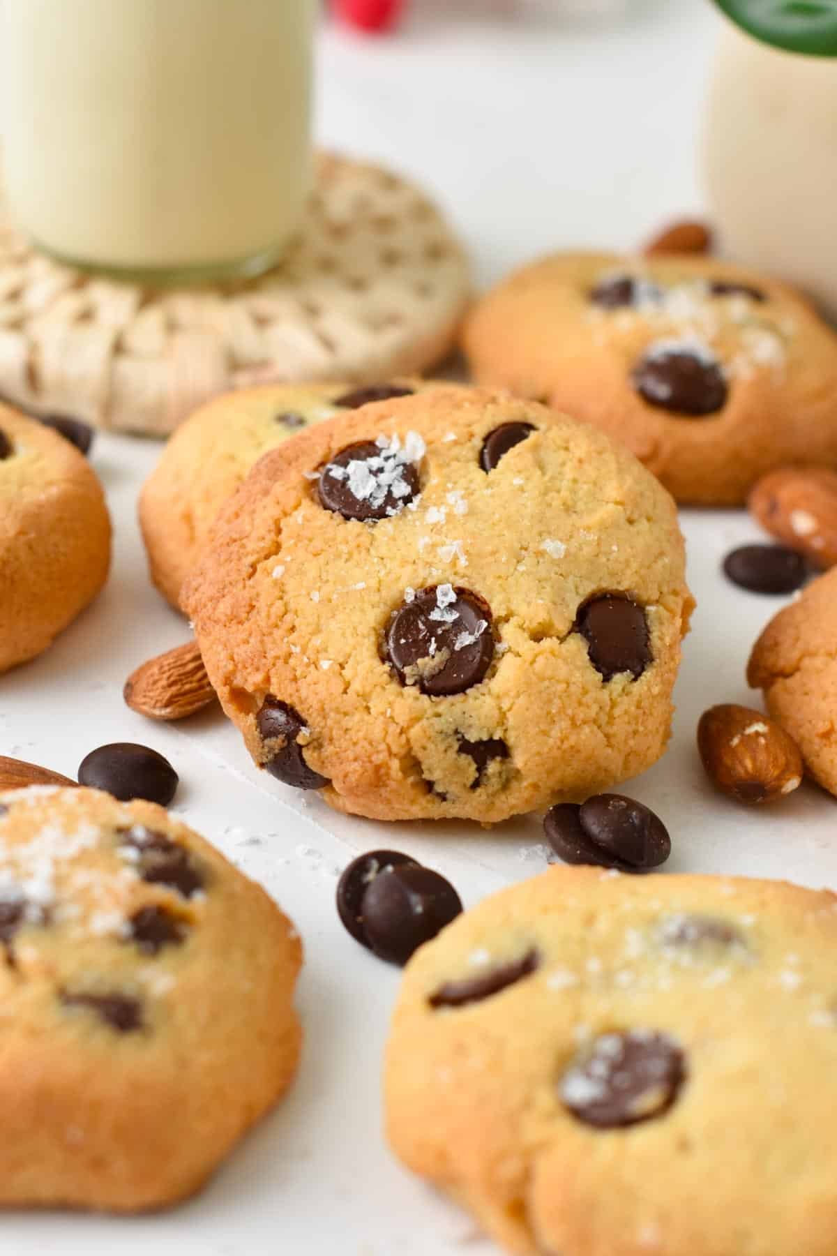 A keto chocolate chip cookie with other cookies around.