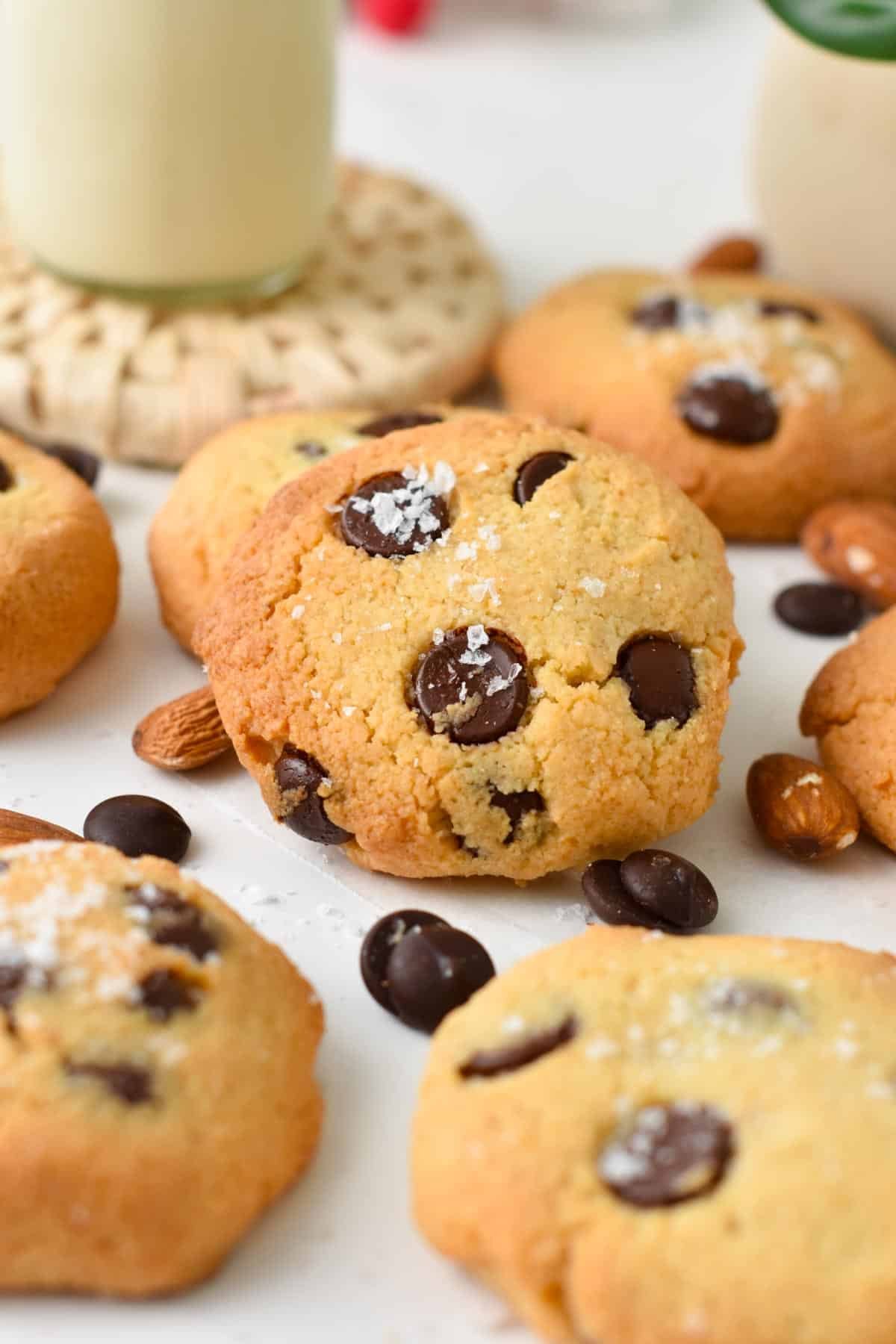 A keto chocolate chip cookie with lots of other cookies around.