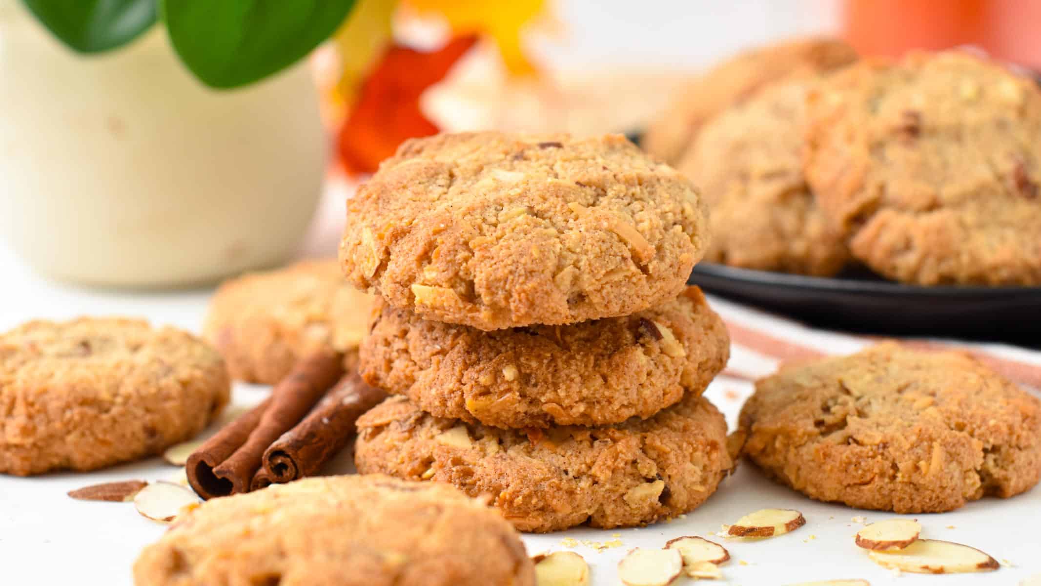 a stack of keto oatmeal cookies made with cinnamon stick on sides and slices almonds