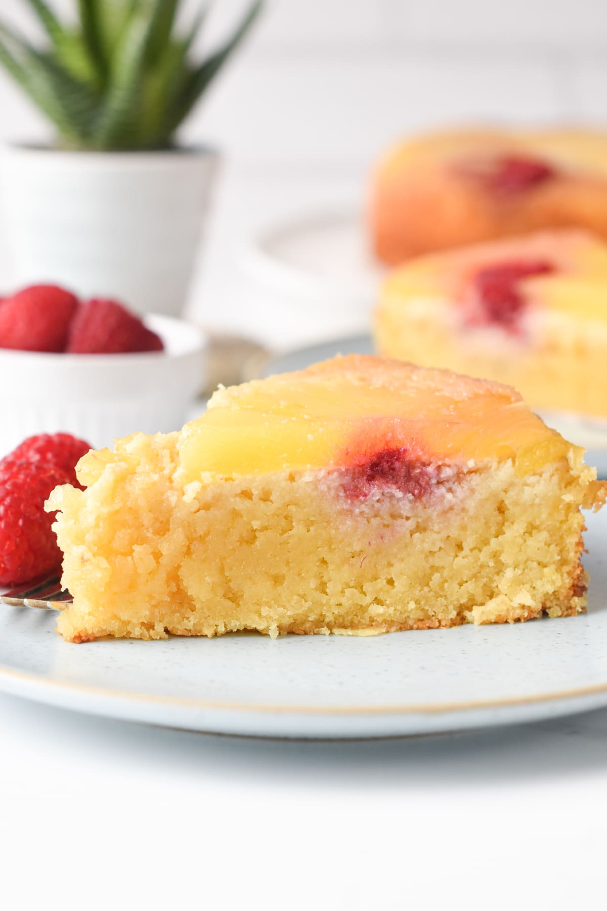 A slice of Keto Pineapple Up Side Down Cake on a small dessert plate.