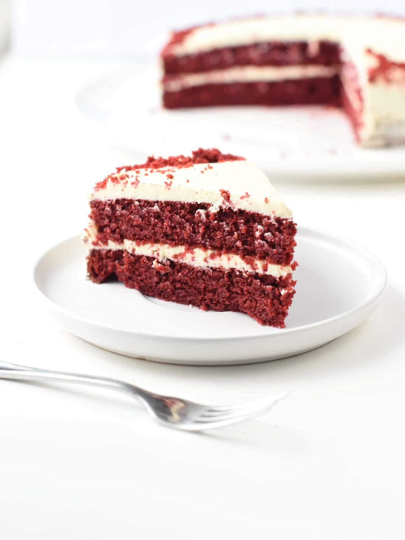 A slice of Keto Red Velvet Cake on a white plate.