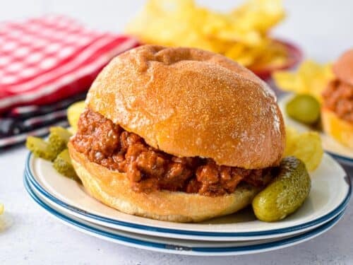 a low-carb bun filled with low-carb sloppy joe filling and gherkins on sides
