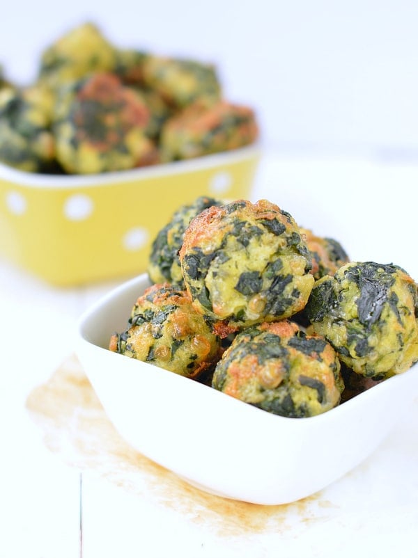 Keto Spinach Balls in a small ramekin.