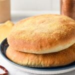 These easy Moroccan Bread are typical Moroccan white bread also called Khobz and traditionally served as a side to Moroccan meals. They are crispy on the outside, with a light semolina flour crispy layer and soft in the middle.
