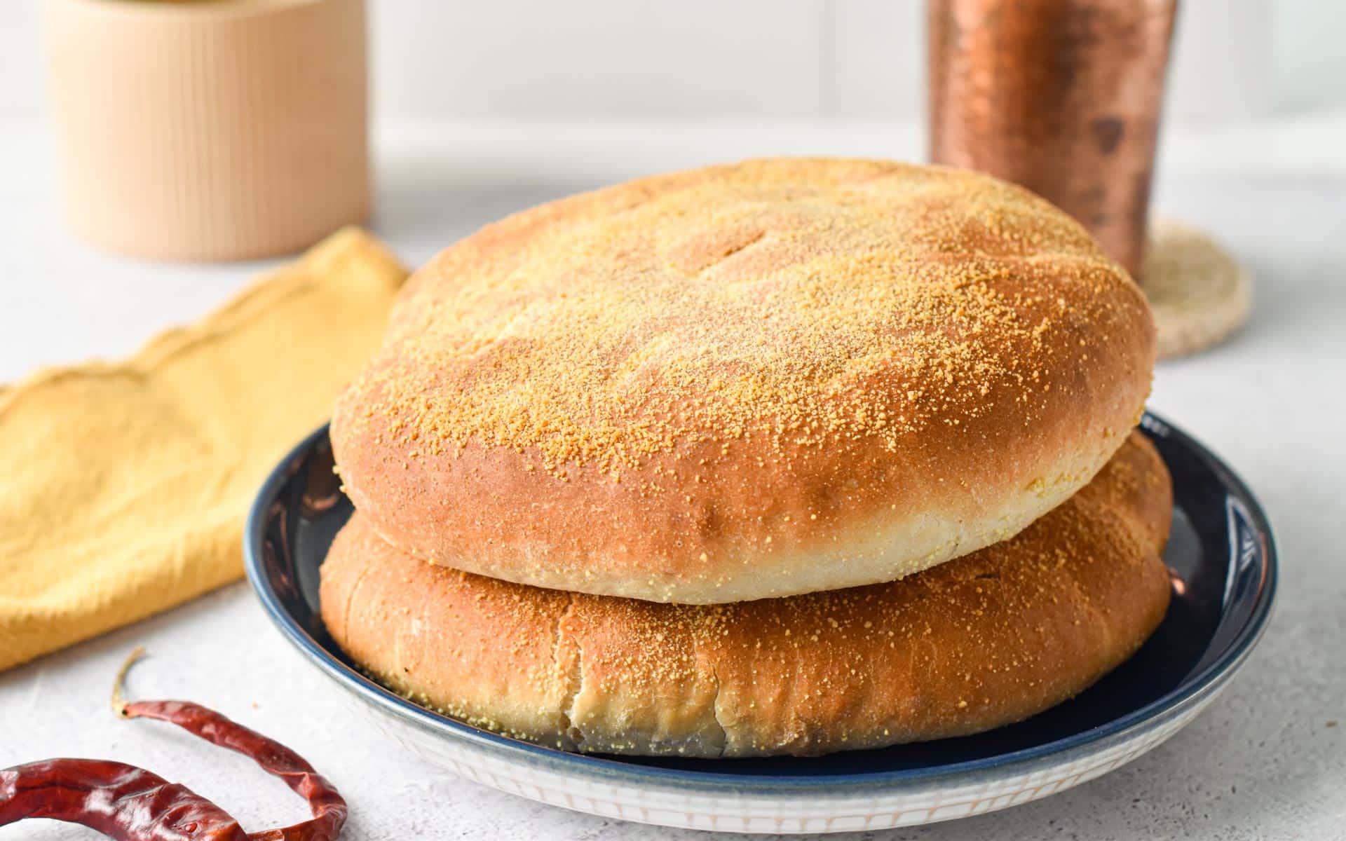 These easy Moroccan Bread are typical Moroccan white bread also called Khobz and traditionally served as a side to Moroccan meals. They are crispy on the outside, with a light semolina flour crispy layer and soft in the middle.