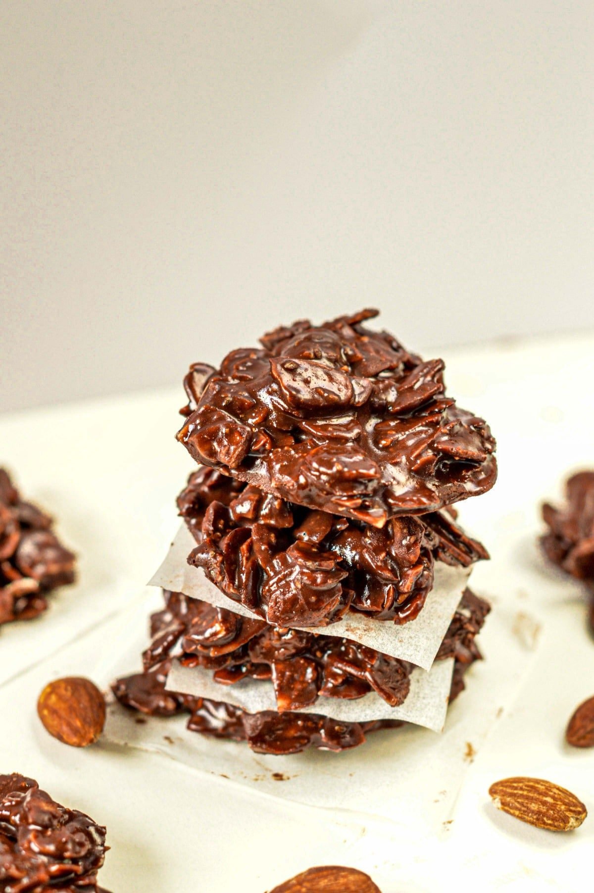 No-Bake Keto Cookies stacked on a white table.