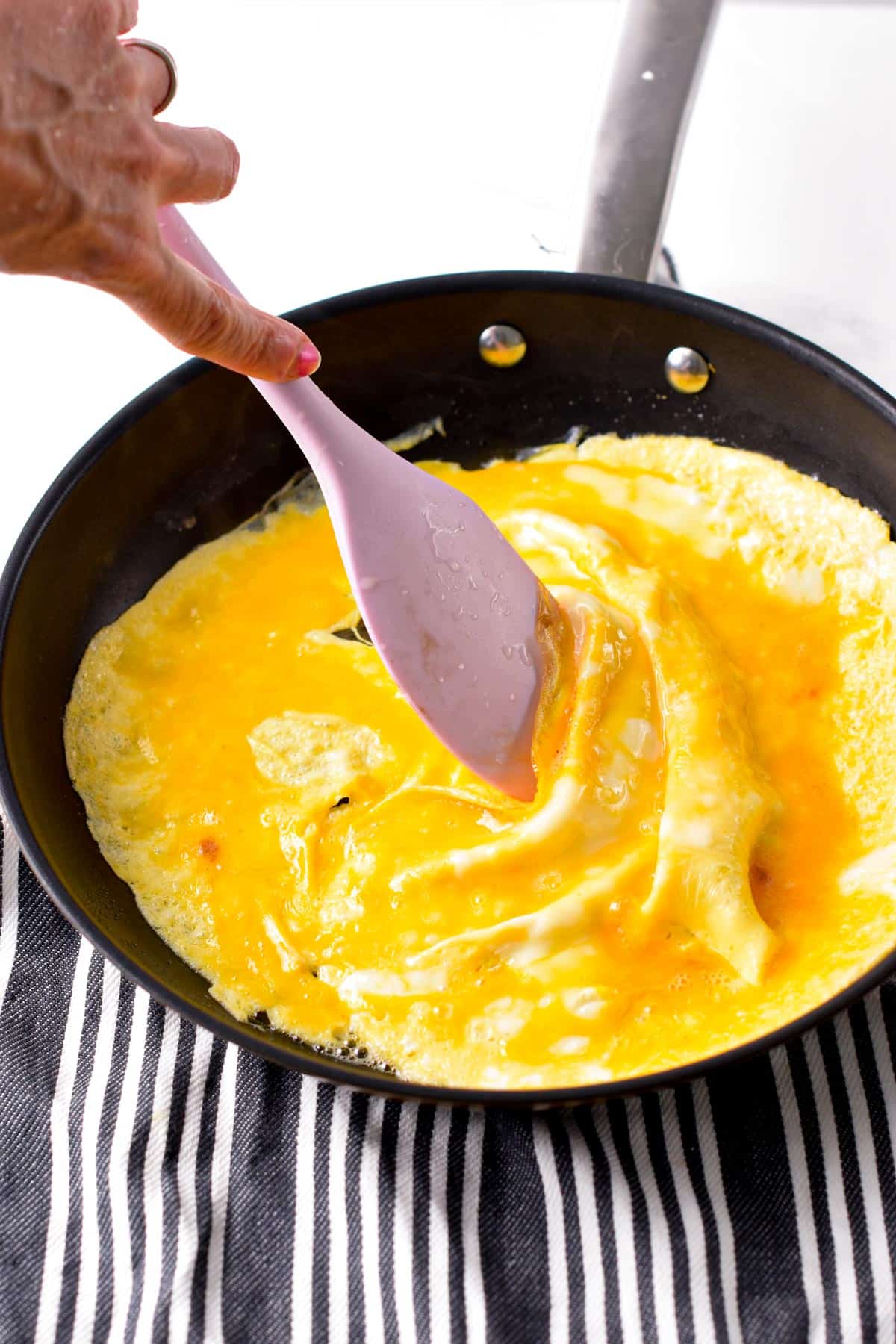 Cooking an Omelette in a large frying pan.