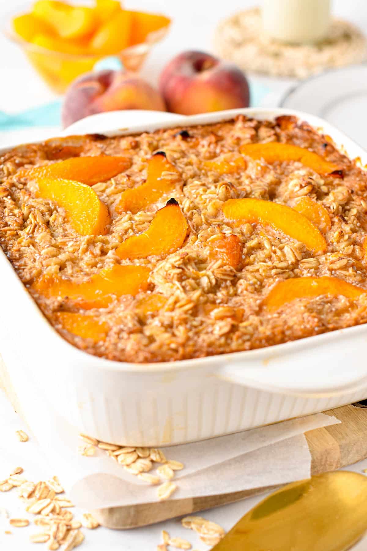 This Peach Baked Oatmeal isa creamy large batch of baked oatmeal filled with juicy peach. The perfect healthy family summer breakfast to use all your peaches this summer.This Peach Baked Oatmeal isa creamy large batch of baked oatmeal filled with juicy peach. The perfect healthy family summer breakfast to use all your peaches this summer.
