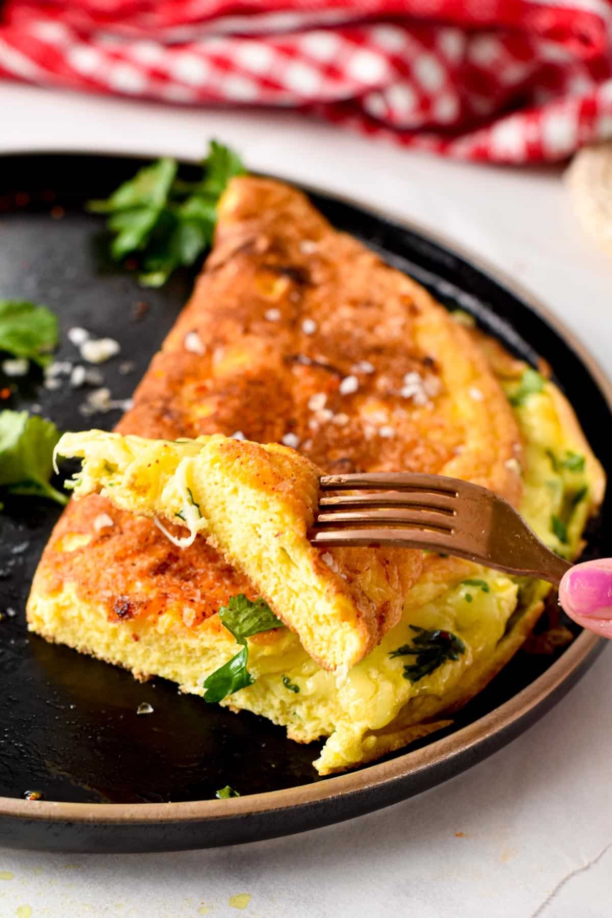 This souffle omelette is the perfect weekend breakfast a light, fluffy omelette with crispy edges and filled with herbs and cheese. Plus, this is a healthy breakfast packed with protein to keep you full for hours and it takes barely 15 minutes to make.