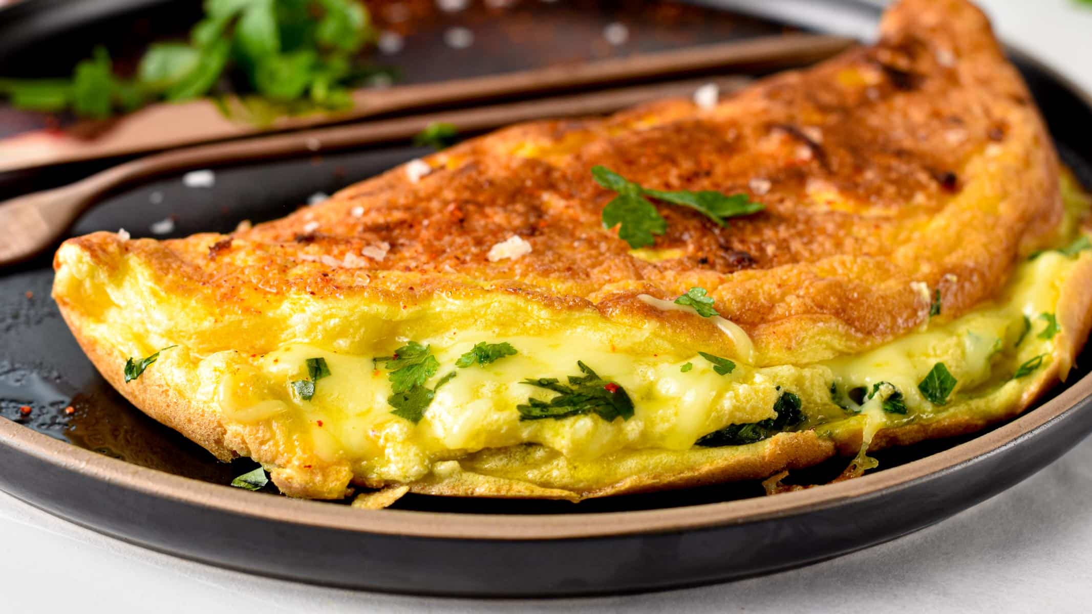 This souffle omelette is the perfect weekend breakfast a light, fluffy omelette with crispy edges and filled with herbs and cheese. Plus, this is a healthy breakfast packed with protein to keep you full for hours and it takes barely 15 minutes to make.