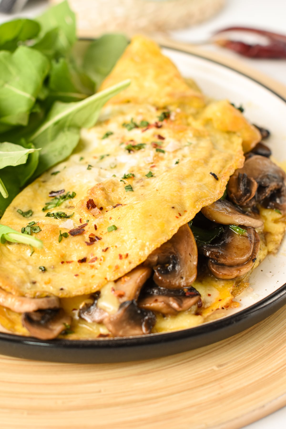 Spinach Mushroom Omelette on a small plate.