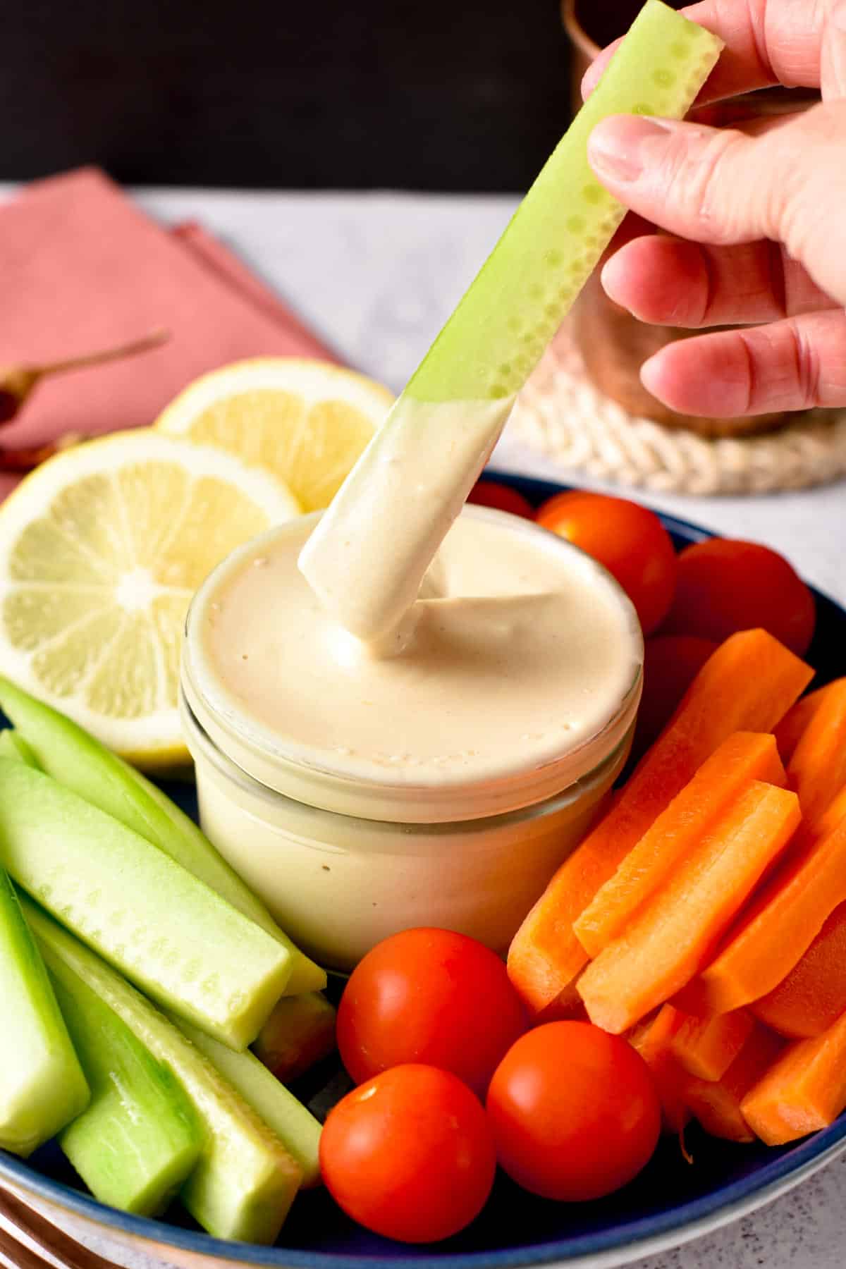 This Tahini Sauce is a creamy dairy-free sauce packed with plant-based proteins from sesame seeds and delicious on top of salad, roasted vegetables or as a tahini salad dressing.